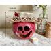 This is a fall apple decoration. It is a real gourd with a happy face  carved into it. This gourd is named Apple and  7 x 6.5 inches.